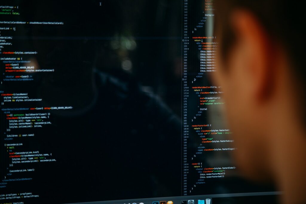 Man coding on computer screen