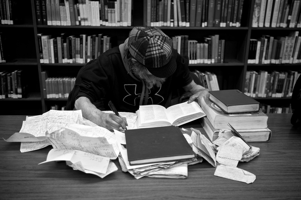 Guy At Library with Abundance of books